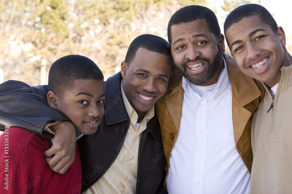 African American father and his teenage sons. African American father and his teenage sons.