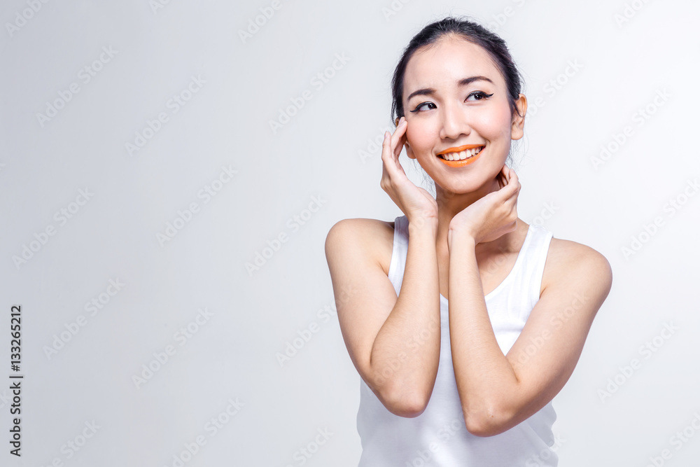 Beautiful woman cares for the skin face - posing at studio isola Beautiful woman cares for the skin face - posing at studio isola