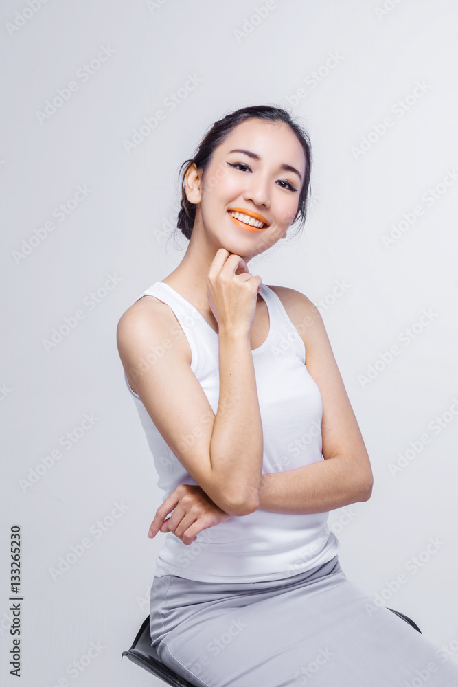 Beautiful woman cares for the skin face - posing at studio isola Beautiful woman cares for the skin face - posing at studio isola