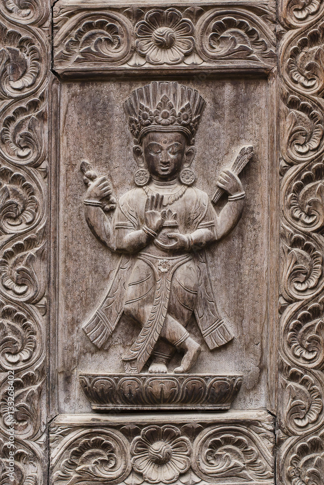 Detail wooden carved door in hindu temple, Kathmandu, Nepal background. Close up