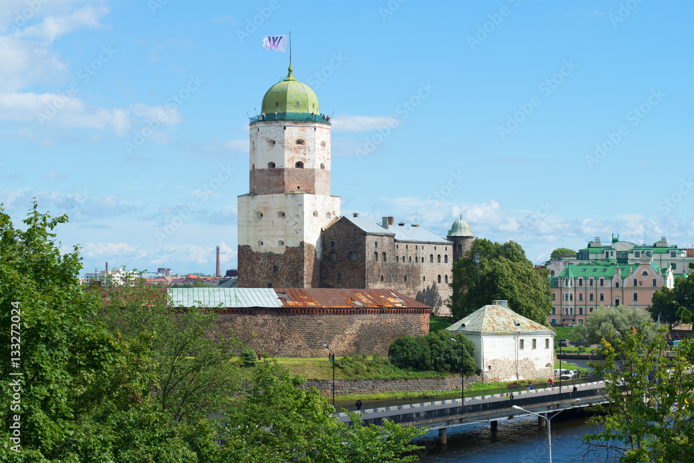 A view of the Vyborg Castle from the Petrovsky hill in the sunny summer day. Vyborg, Leningrad region