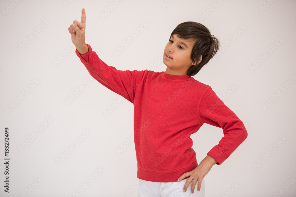 Cute school kid posing in studio with different facial expressio Cute school kid posing in studio with different facial expressio