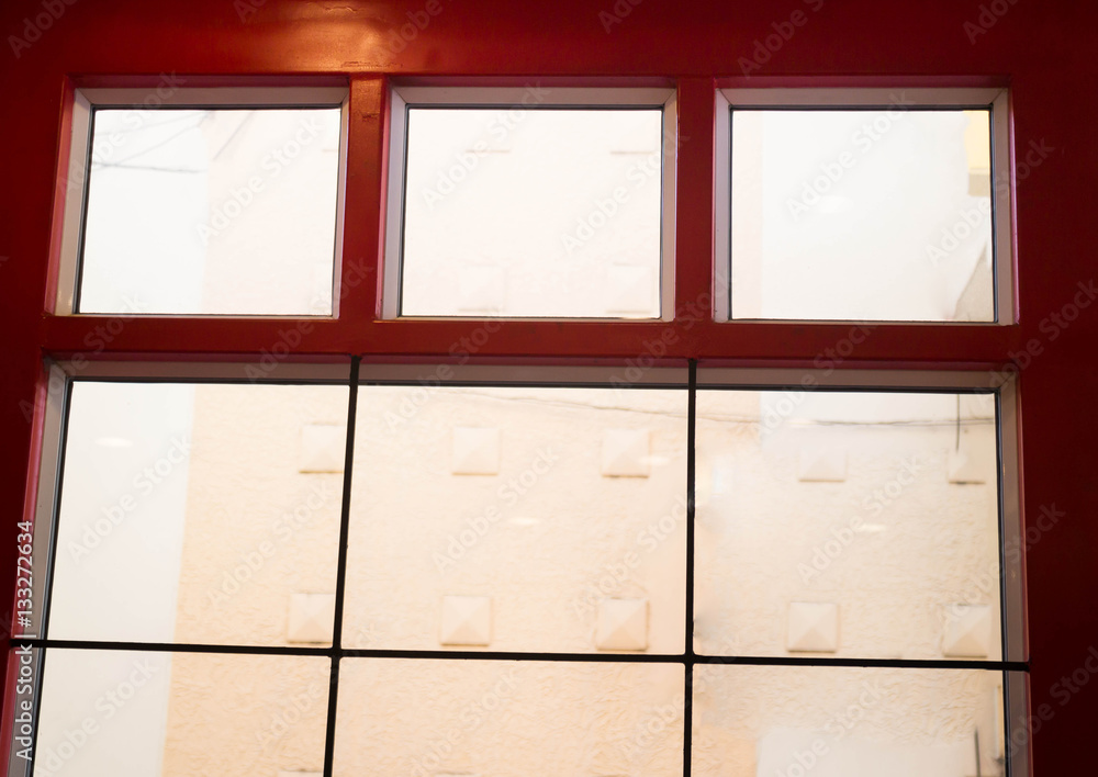 Fototapeta premium Colonial building with red window