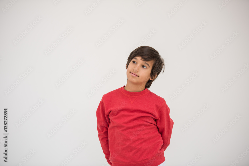 Cute school kid posing in studio with different facial expressio Cute school kid posing in studio with different facial expressio