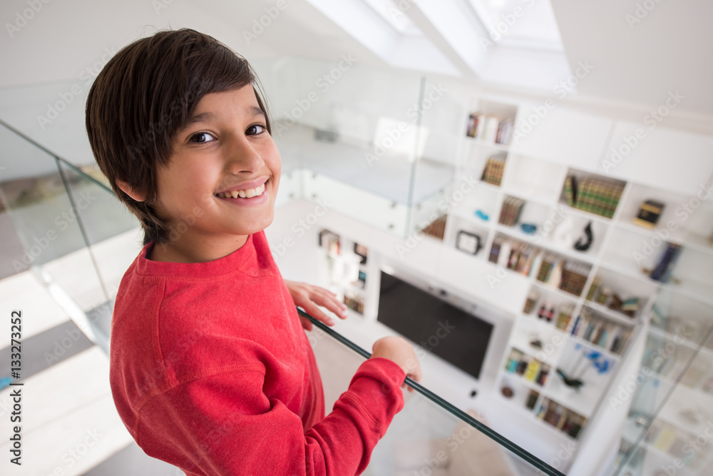 Child inside interior of modern home Child inside interior of modern home