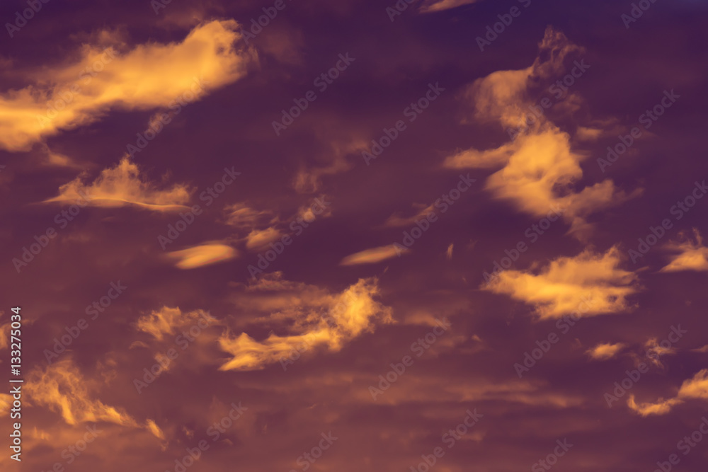 Colorful clouds of various shades on sunrise sky