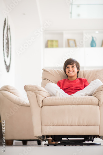 Kid relaxed on sofa