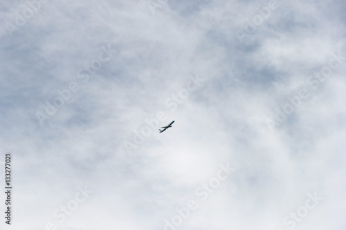 Tiny plane in the sky