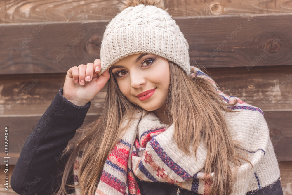Teen girl is wearing warm winter hat
