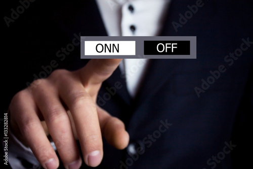 Businessman pressing ON OFF button