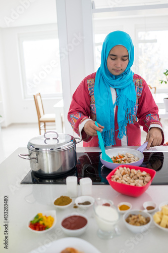 Young Muslim Arabic woman in the kitchen