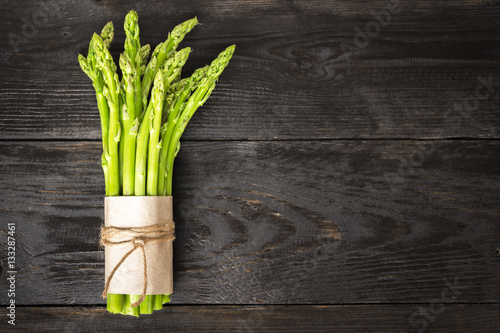 Bunch of fresh asparagus on a rustic wooden table