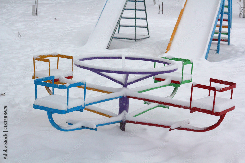 Naklejka premium Swing in In the snow. Winter. Bright. Cheerful. Fun.