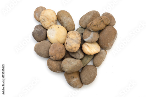 Stones in heart shape with white background.