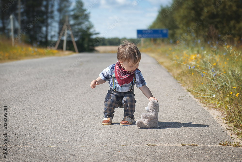 Little boy walking in the garden Little boy walking in the garden