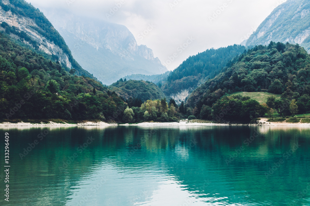 Lago di Tenno - lake with turquoise water in Tenno, Trentino, Italy.