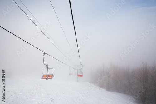 Ski lift with seats going over the mountain  © Ivanna Pavliuk