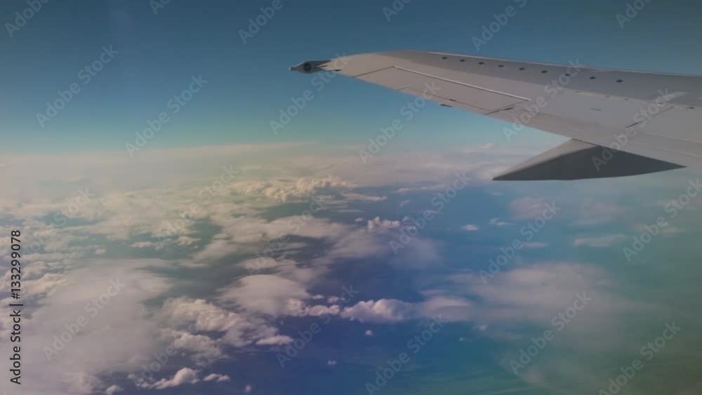 Travel by air. View through an airplane window on the cloud landscape. Travel by air. View through an airplane window on the cloud landscape.