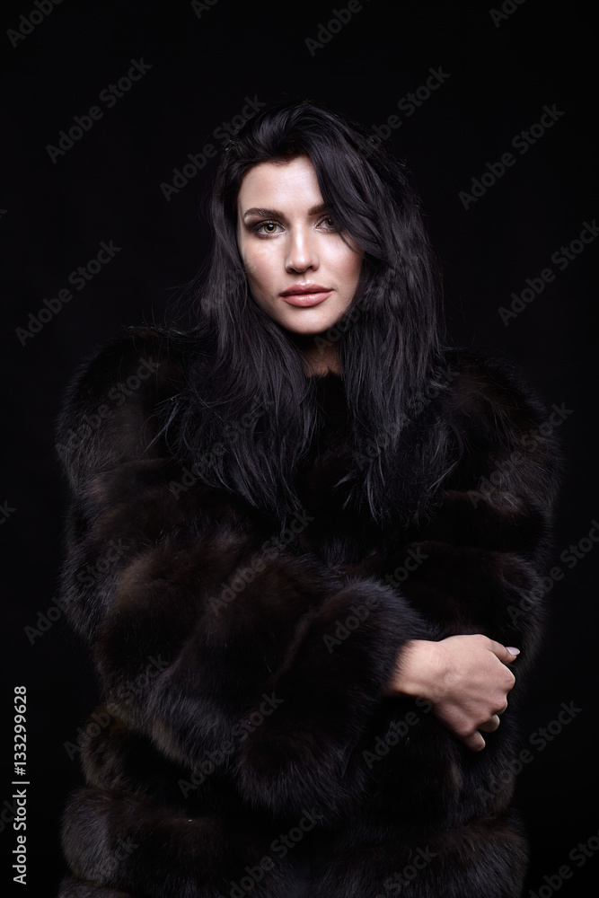 Portrait of a young brunette woman with long black hair dressed Portrait of a young brunette woman with long black hair dressed