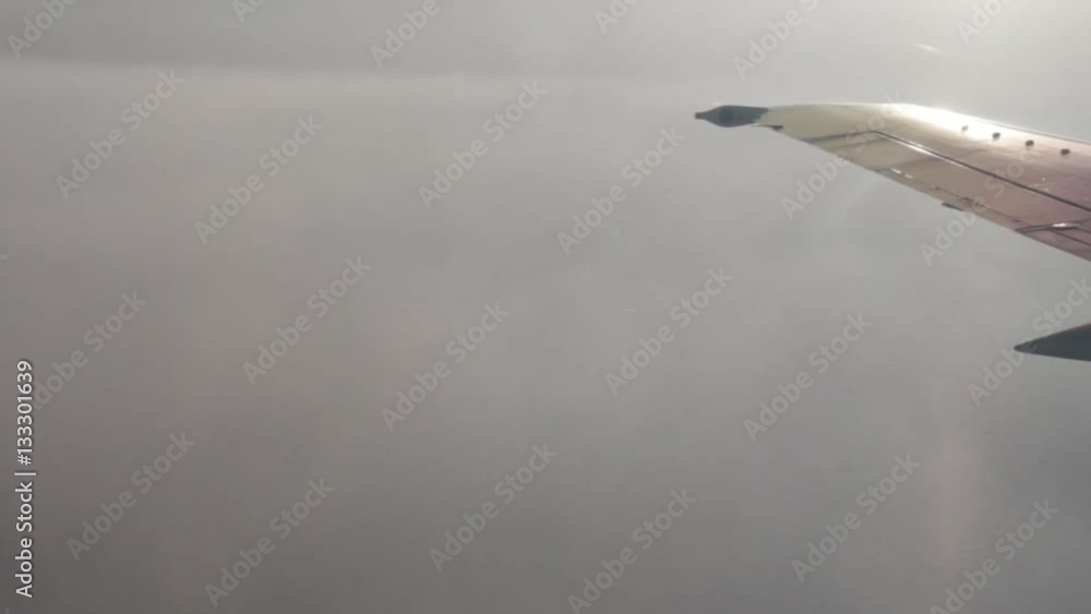 Travel by air. View through an airplane window on the cloud landscape. Travel by air. View through an airplane window on the cloud landscape.