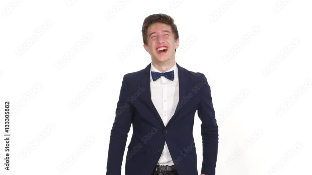 Young man laughing and pointing with a finger Young man laughing and pointing with a finger