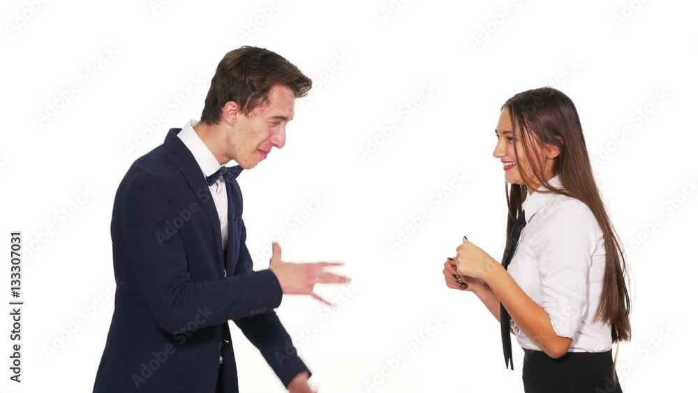 Office colleagues chatting and shaking hands friendly Office colleagues chatting and shaking hands friendly