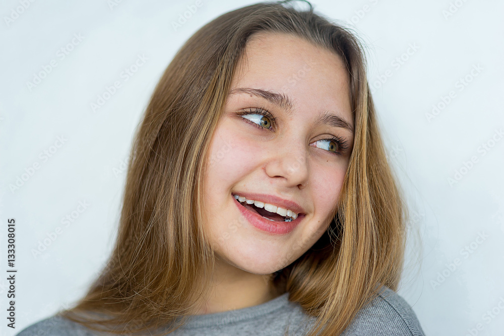 Teenager girl posing on white background isolated