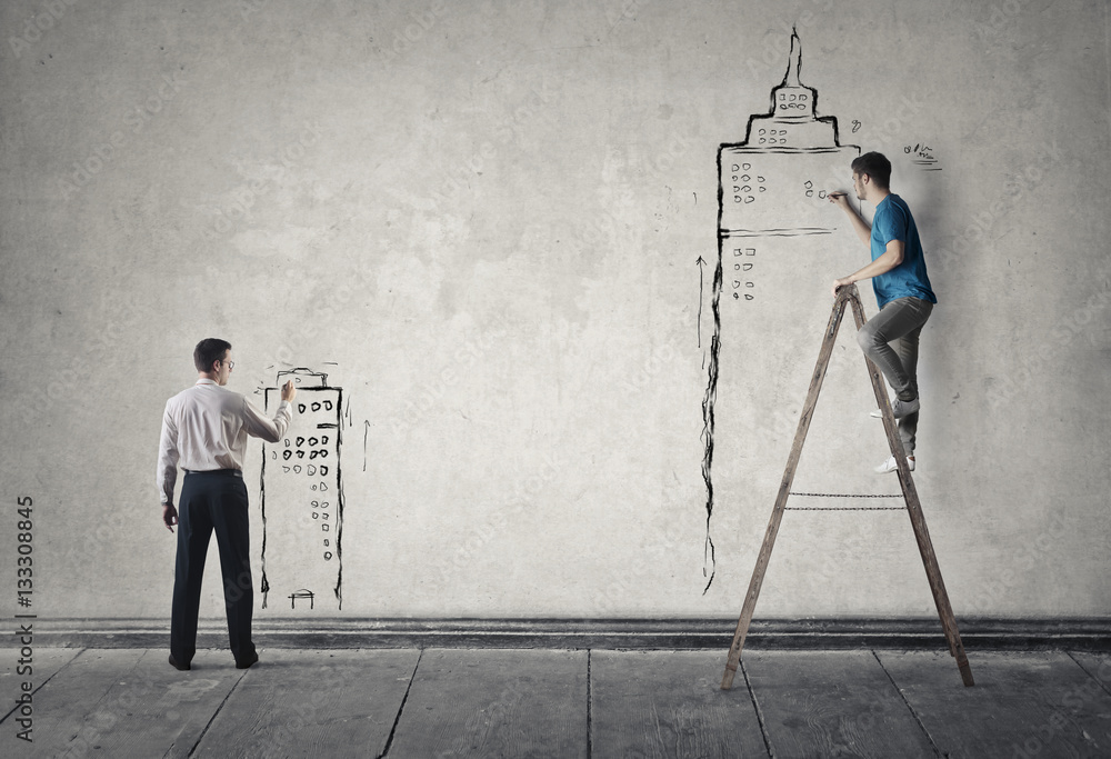 Fototapeta premium Men drawing on the wall