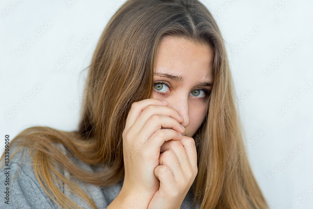 Naklejka premium Teenager girl emotional posing isolated