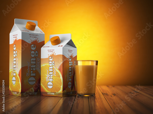 Orange juice carton cardboard box pack with glass on orange back photo