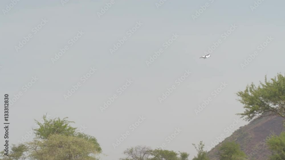 LOW ANGLE VIEW: air safari plain flying over Serengeti national park LOW ANGLE VIEW: air safari plain flying over Serengeti national park
