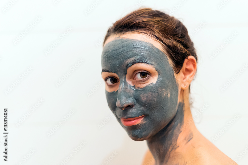 Mask of clay on the girl's face Mask of clay on the girl's face