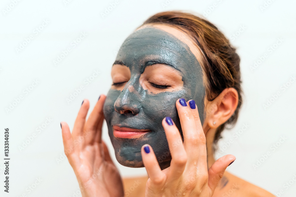 Mask of blue clay on the girl's face Mask of blue clay on the girl's face