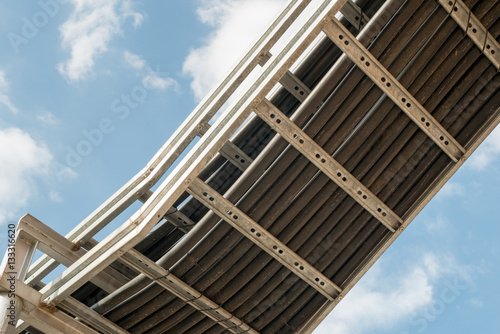 Ladder cable tray and blue sky background, high voltage wire