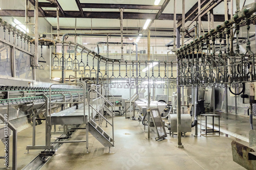 Empty butchering workshop poultry with overhead conveyor. Poultry processing plant line. Production of chicken meat. photo