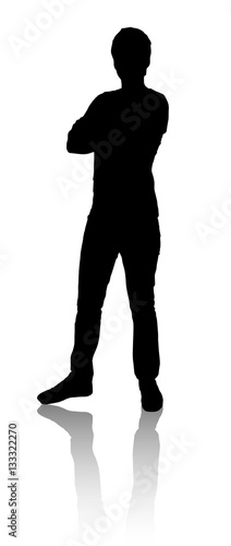 Silhouette of a man who stands. The crossed his arms