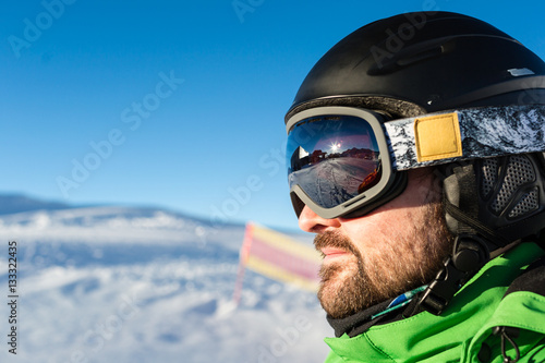 Male skier with large oversized ski goggles