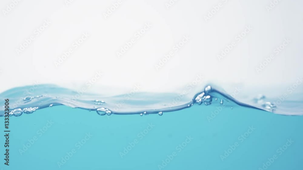 side view of blue toned water waves in slow motion, 180fps prores footage side view of blue toned water waves in slow motion, 180fps prores footage