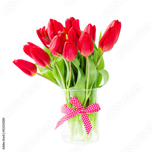 Red tulips bouquet in vase. Isolated over white background 