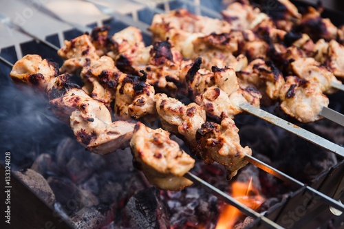 Cooking meat on the fire. Shish kebab on the grill (top view)