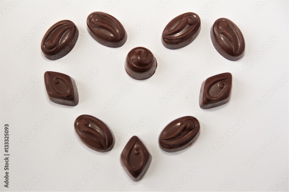 Chocolate candy hearts on a white background Chocolate candy hearts on a white background