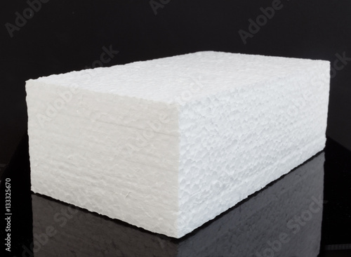 Obraz na plátně Brick shape white styrofoam block on black background.