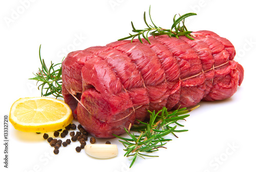 roast of beef with rosemary on white photo