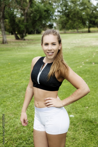 Caucasian Teen Woman Exercise Shorts And Top In Park