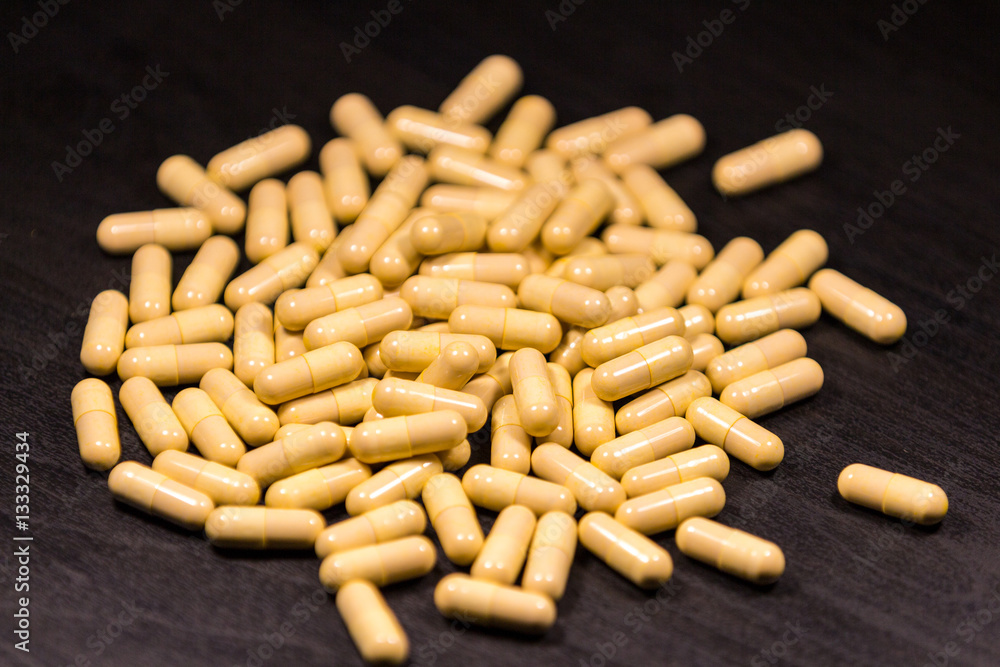 Pills medication on black background Pills medication on black background