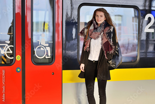 Young woman on a train station.