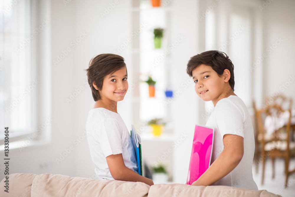 Happy kids at home with books Happy kids at home with books