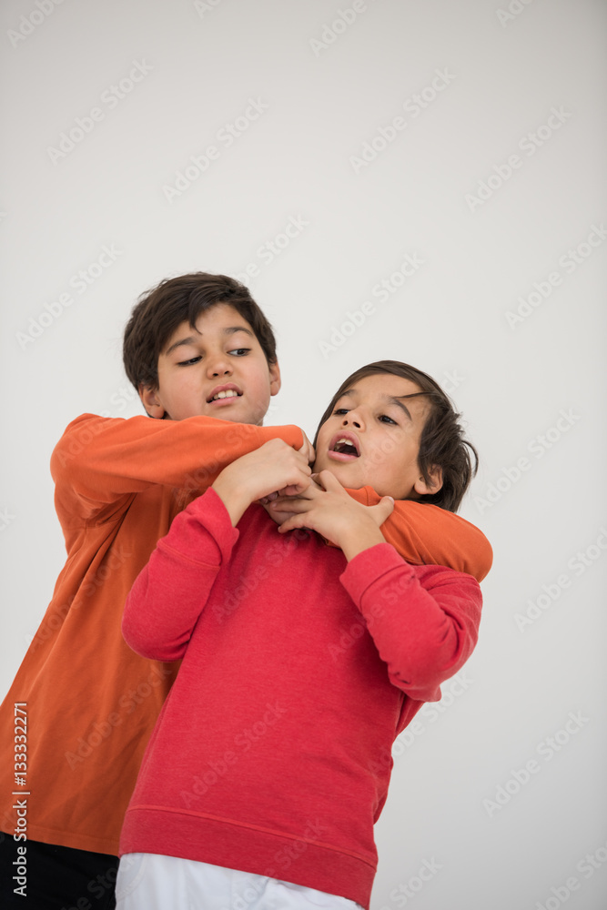 Cute school kid posing in studio with different facial expressio Cute school kid posing in studio with different facial expressio