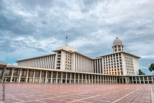 Beautiful view of Istiqlal Mosque, at the morning in cloudy day in Jakarta, Indonesia photo
