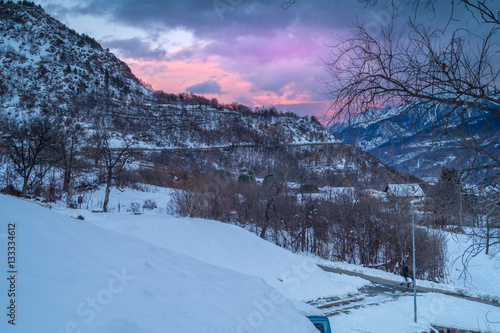 sunset in the mountains, the landscape in the snow and pink sky